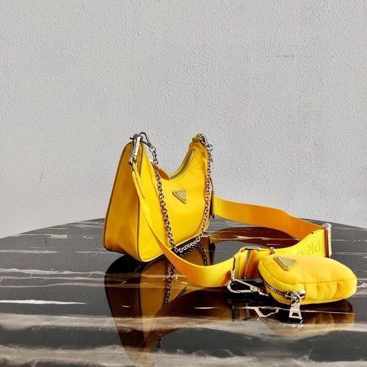65324ef2cb3fd.jpg Replica Prada 1BH204 Prada Re-Edition 2005 Nylon Bag Yellow - 图片 1