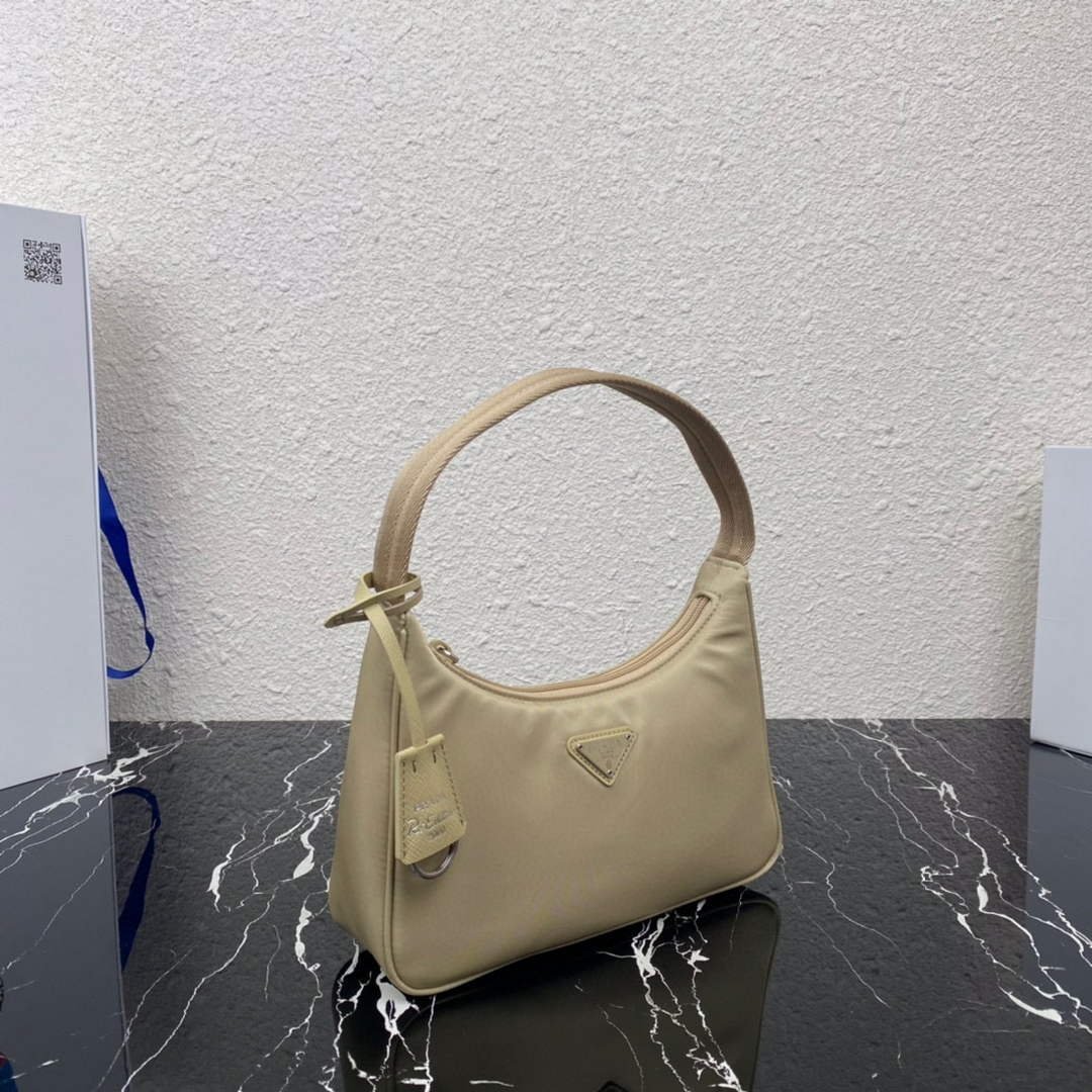 653254a7f3d1e.jpg Replica Prada 1NE515 Re-Nylon Re-Edition 2000 mini-bag Apricot - 图片 1